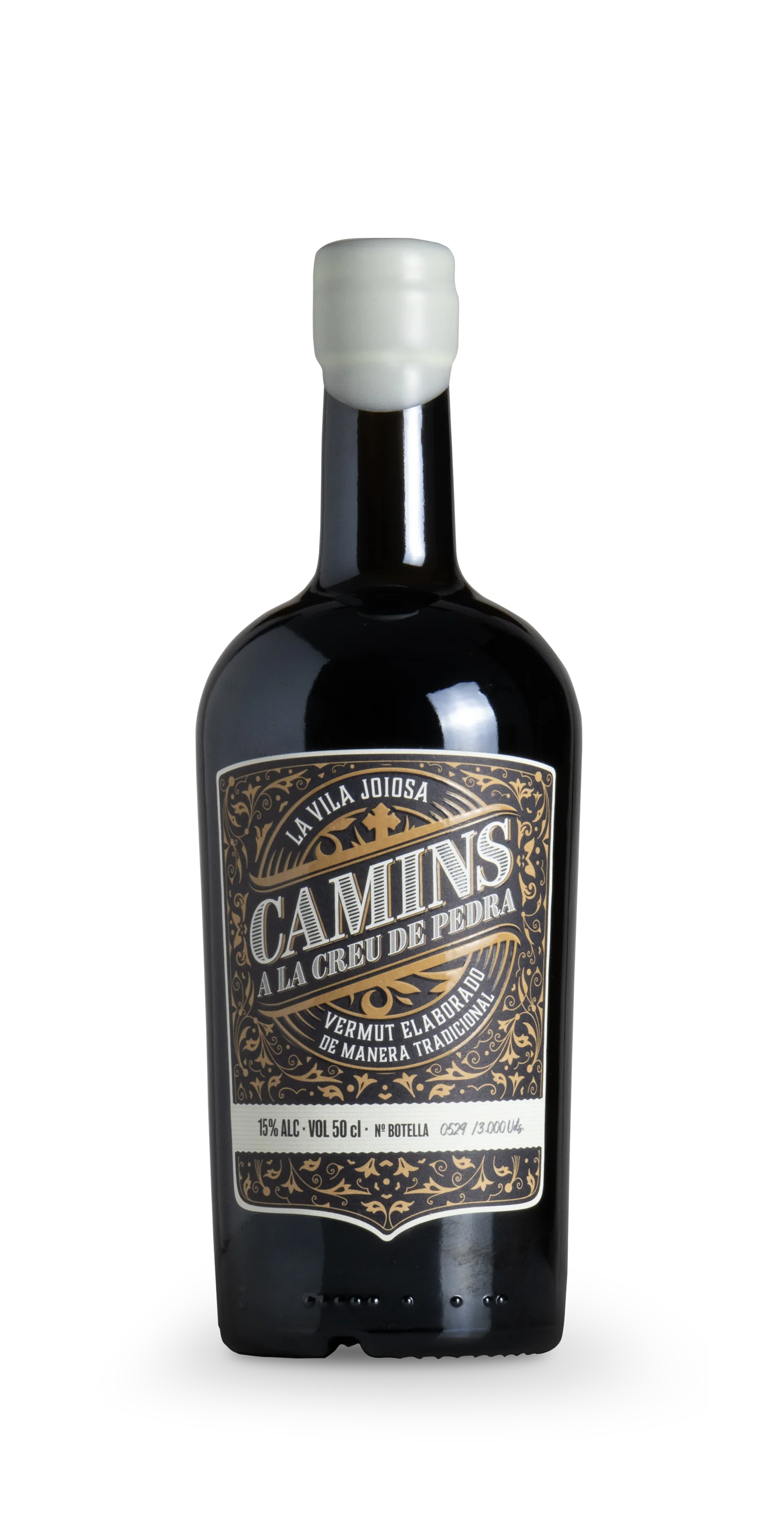 Botella de Camins a la Creu de Pedra, etiqueta ornamental con cera blanca y leyenda Vermut elaborado de manera tradicional