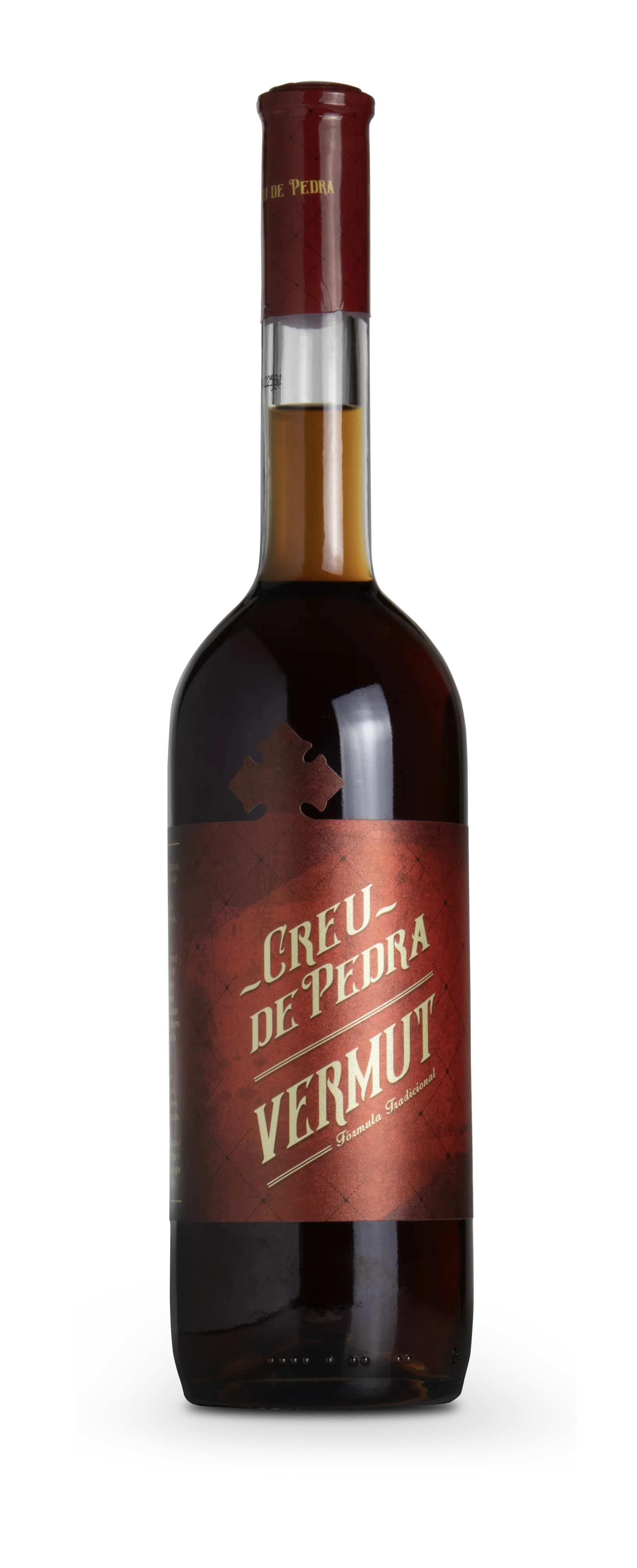 Botella de Creu de Pedra Vermut, etiqueta roja con cruz y leyenda Fórmula Tradicional